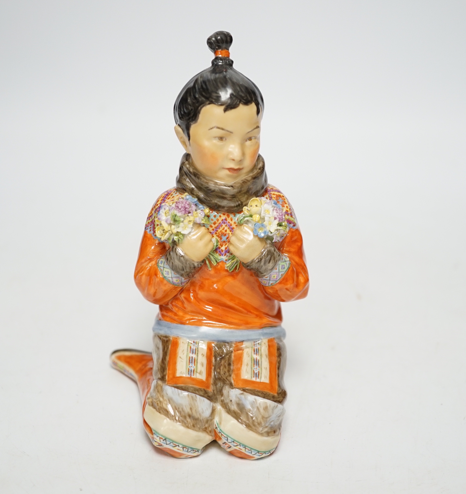 A Royal Copenhagen overglaze figure Greenlandic Girl, designed by Carl Martin-Hansen, National Costume Series, 15cm high